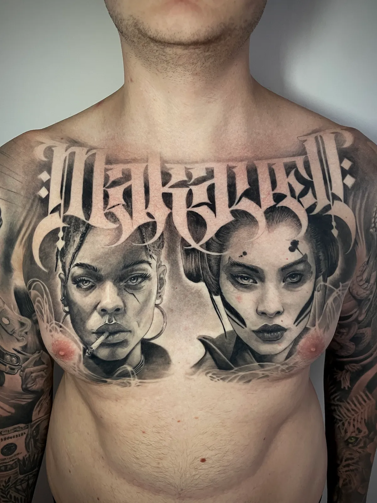 Black and grey realism Makaveli lettering with dual woman portraits Chicano style chest piece tattoo by Andras Tattoo